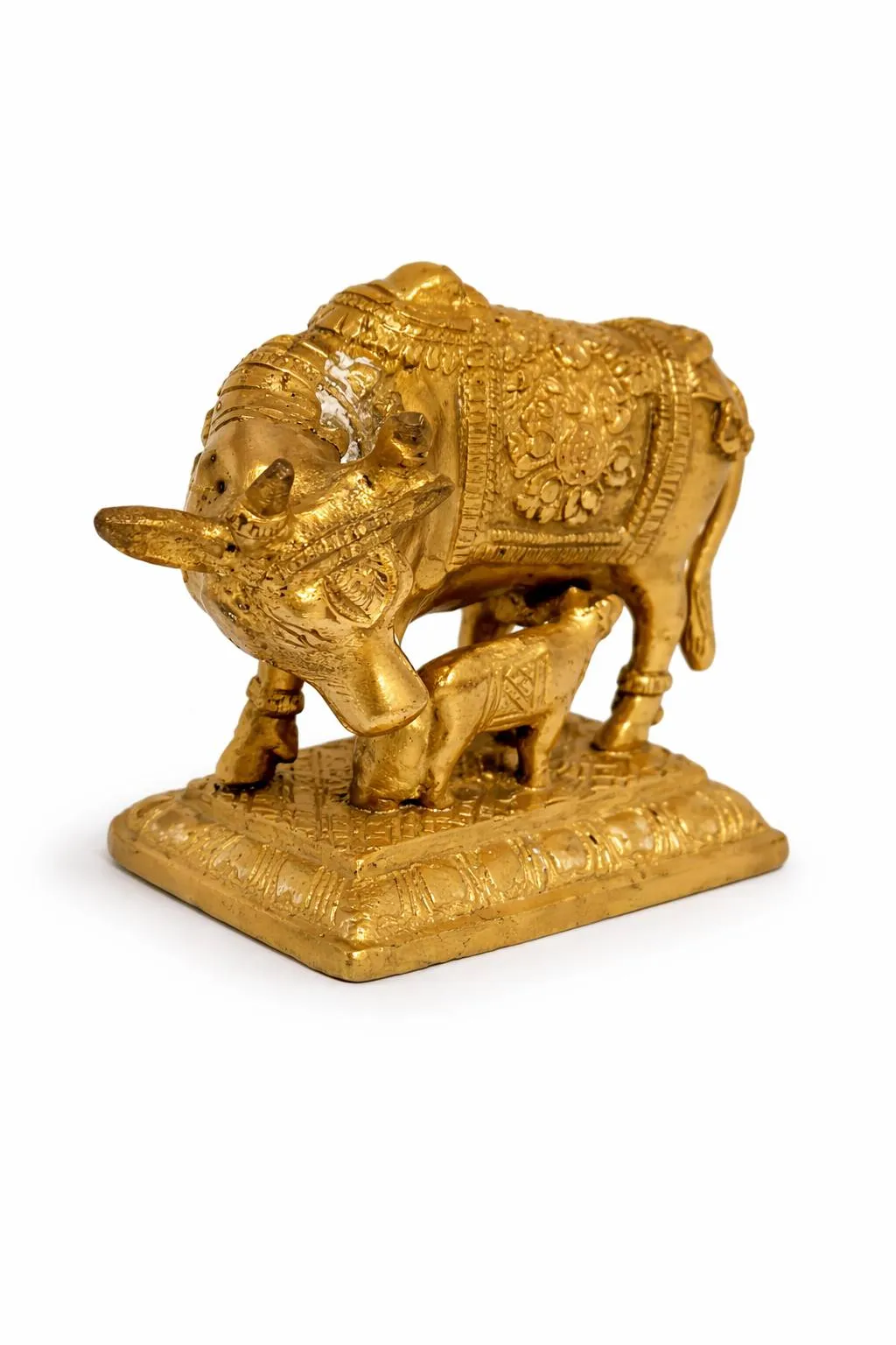 Kamdhenu Brass Statue — three-quarter view showing ornamental base detail (Vastuguruji)